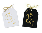 Gold foil For You with a gold heart above for, on white and black linen paper with a metallic gold tie. 3.5x4.5