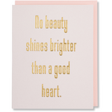 No Beauty Shines Brighter Than A Good Heart. Gold foil embossed quote greeting card on light pink paper with a blush envelope. 