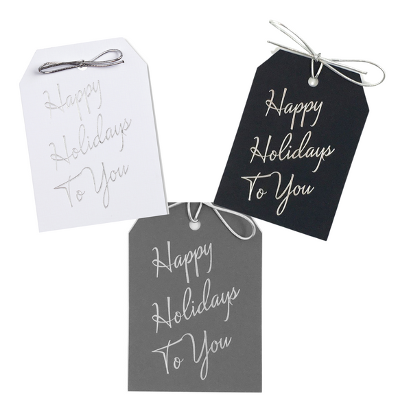 Happy Holidays To You gift tags on thick white, gray, or black paper. Silver foil stamped with a metallic silver tie. 