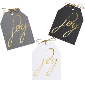 Joy gold foil gift tags on gray, black, and white linen paper with metallic gold ties. 4x5.5"