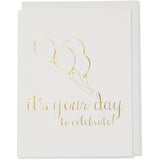 Gold Foil Embossed Celebrate, Congratulations, Graduation, Birhtday Card. it's your day to celebrate! image of 4 balloons on the card. Natural white cotton paper with a natural white cotton envelope or a white godl metallic envelope