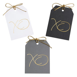 Gold foil XO gift tags on white, black,and gray paper with metallic gold ties. 3x4"