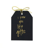 Gold foil i know you like gifts,3.5x4.5 " gift tag on black linen paper with metallic gold tie.